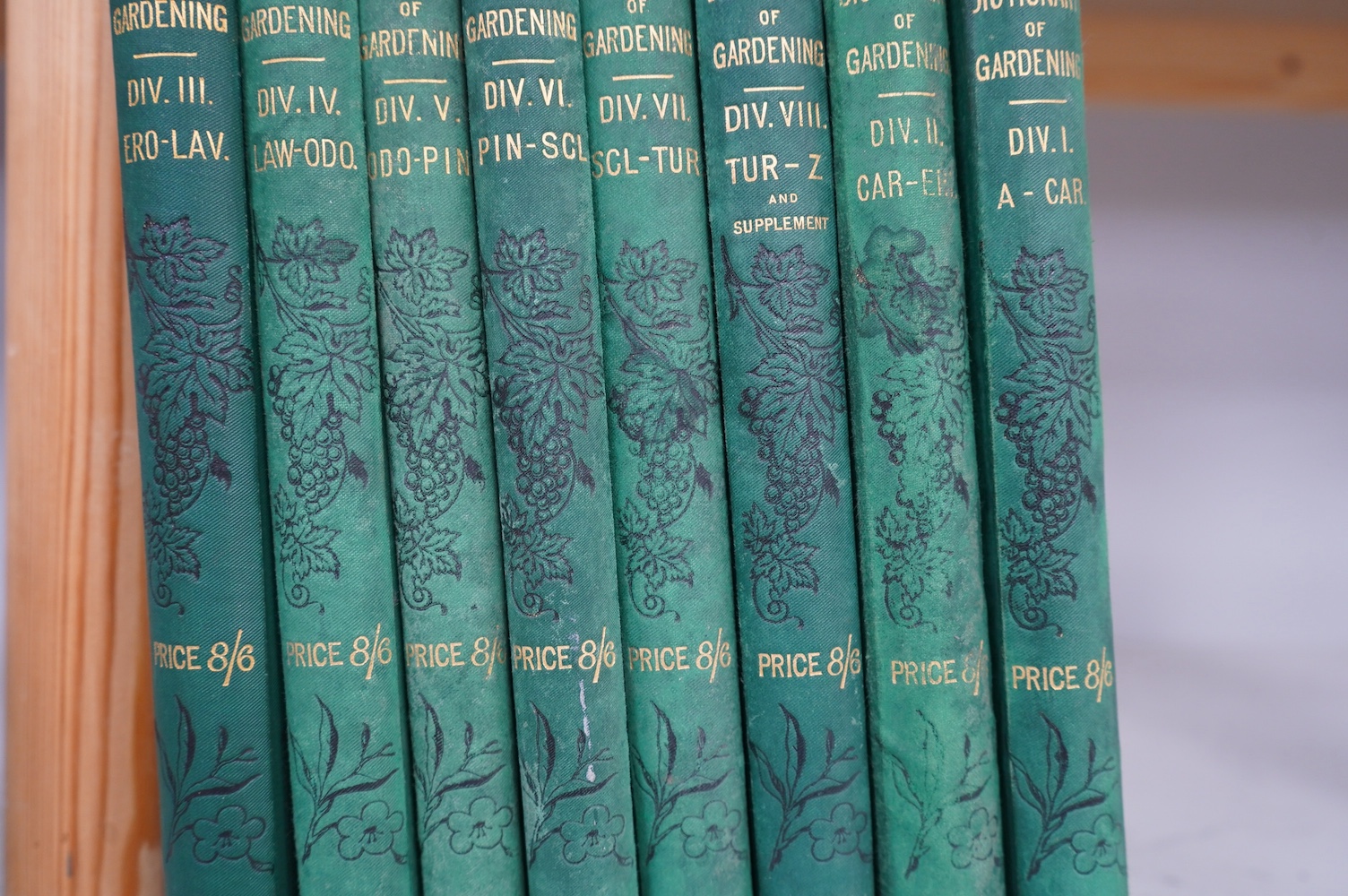 Nicholson, George (editor) - The Illustrated Dictionary of Gardening, 8 vols, 4to, green pictorial boards, c.1885. Condition - poor/fair